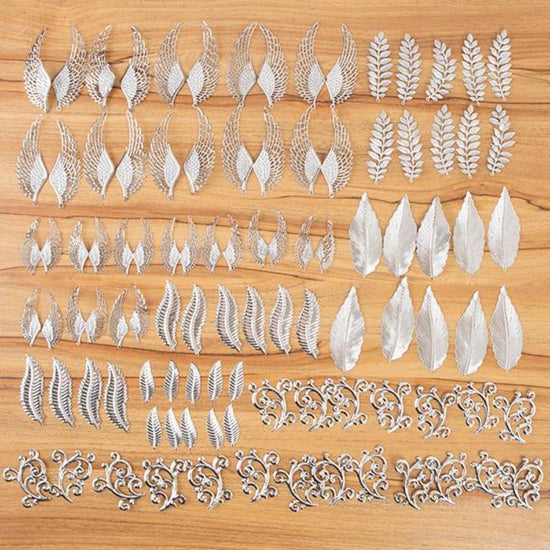 Load image into Gallery viewer, 537945: Craft Buddy Set of 100 Filigree Feather, Flourish and Leaf Embellishments

